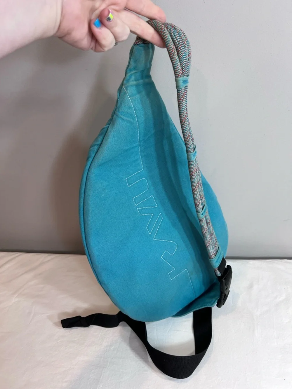 Kavu teal rope sling bag backpack